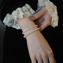 施家金珠珍珠手链女款2024新款高级感轻奢小众弹力绳珍珠手串叠戴