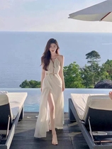云南三亚旅游拍照沙滩裙海边度假连衣裙纯欲性感镂空白色吊带长裙